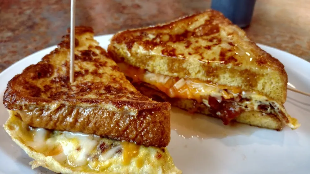 French Toast Eggs Cheese and Bacon Sandwich